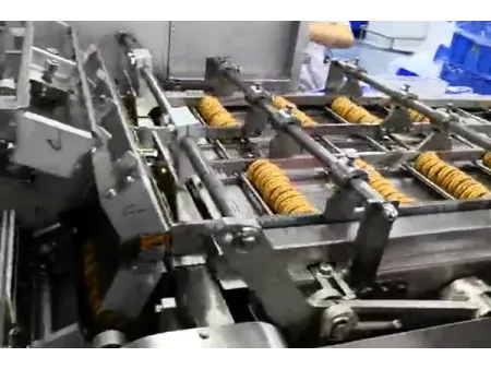 Sistema automático de envasado de snacks apilados