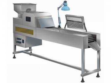 Máquina para la inspección de tabletas y cápsulas